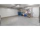 Spacious garage with epoxy flooring and storage racks for organization and functionality at 2204 Plaza De La Candela, Las Vegas, NV 89102