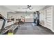 Spacious home gym with padded flooring, ceiling fan, exercise equipment, and mirrored wall at 2204 Plaza De La Candela, Las Vegas, NV 89102