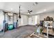 Another angle of this home gym, including mounted weights and a treadmill at 2204 Plaza De La Candela, Las Vegas, NV 89102