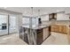 Beautiful kitchen with marble island, modern appliances, and access to outdoor patio at 2204 Plaza De La Candela, Las Vegas, NV 89102