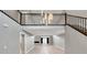 Spacious living room featuring high ceilings, a modern staircase, and open floorplan at 2204 Plaza De La Candela, Las Vegas, NV 89102