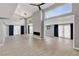 Bright living room with fireplace, high ceilings, and floor-to-ceiling windows at 2204 Plaza De La Candela, Las Vegas, NV 89102