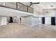 Open concept living area with a loft overlooking the floor, with grey walls and neutral tile at 2204 Plaza De La Candela, Las Vegas, NV 89102