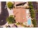 Aerial view showcasing a home with a backyard pool, patio, and well-manicured landscaping at 2547 Serenity Hollow Dr, Henderson, NV 89052