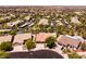 Neighborhood aerial view shows community architecture and landscaping, highlighting the tranquil residential setting at 2547 Serenity Hollow Dr, Henderson, NV 89052