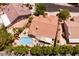Overhead aerial of a home with a private pool, patio, and lush backyard landscaping at 2547 Serenity Hollow Dr, Henderson, NV 89052