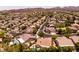 Panoramic aerial view of a residential neighborhood with tree-lined streets and diverse home styles at 2547 Serenity Hollow Dr, Henderson, NV 89052