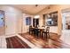 Dining room featuring dark wood floors, a wood table, and decorative art at 2547 Serenity Hollow Dr, Henderson, NV 89052