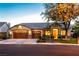 Beautiful single-story home features a three-car garage and well-manicured landscaping at 2547 Serenity Hollow Dr, Henderson, NV 89052