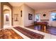 Open floor plan featuring a game room with a pool table and a view of the dining room at 2547 Serenity Hollow Dr, Henderson, NV 89052