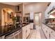 Updated kitchen featuring granite countertops, stainless steel appliances, and ample cabinet space at 2547 Serenity Hollow Dr, Henderson, NV 89052