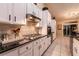Modern kitchen with stainless steel appliances, sleek cabinetry, and a stylish backsplash at 2547 Serenity Hollow Dr, Henderson, NV 89052