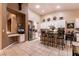 Well-appointed kitchen with an island, stainless steel appliances, and a cozy breakfast bar at 2547 Serenity Hollow Dr, Henderson, NV 89052