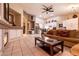 Spacious living room with tile flooring, fireplace, and a comfortable seating area at 2547 Serenity Hollow Dr, Henderson, NV 89052