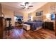 Serene bedroom with wood floors, a ceiling fan, and plenty of natural light at 2547 Serenity Hollow Dr, Henderson, NV 89052