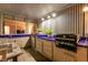 Covered outdoor kitchen with a built-in grill and ample counter space at 2547 Serenity Hollow Dr, Henderson, NV 89052