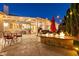 Inviting backyard patio with a fire pit, dining area, and covered seating perfect for entertaining at 2547 Serenity Hollow Dr, Henderson, NV 89052
