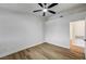 Spacious bedroom with modern ceiling fan, wood-look flooring, and ample natural light at 2725 S Nellis Blvd # 2036, Las Vegas, NV 89121