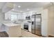 Bright kitchen featuring white cabinets, stainless steel appliances, and a large countertop at 2725 S Nellis Blvd # 2036, Las Vegas, NV 89121