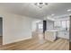 Open-concept kitchen features white cabinetry, quartz countertops, and modern lighting fixtures at 2725 S Nellis Blvd # 2036, Las Vegas, NV 89121