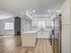 Modern kitchen showcases white cabinets and countertops, flowing into an open living space at 2725 S Nellis Blvd # 2036, Las Vegas, NV 89121