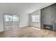 Bright living room featuring modern fireplace, sliding glass door, and wood-look flooring at 2725 S Nellis Blvd # 2036, Las Vegas, NV 89121