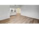 Spacious living area with wood-look flooring, flowing into the kitchen at 2725 S Nellis Blvd # 2036, Las Vegas, NV 89121