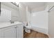 Bright bathroom with white vanity, full tub, and modern fixtures at 2834 Crystal Lantern Dr, Henderson, NV 89074