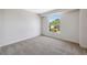Bedroom featuring a large window and neutral carpet, providing a serene space with ample natural light at 2834 Crystal Lantern Dr, Henderson, NV 89074