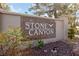 Stone Canyon community sign surrounded by desert landscaping and mature trees at 2834 Crystal Lantern Dr, Henderson, NV 89074