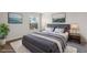 Beautiful staged primary bedroom with large bed, modern decor, and large windows at 2834 Crystal Lantern Dr, Henderson, NV 89074