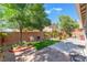 Inviting backyard featuring a lawn and well-maintained landscaping at 329 Gemstone Hill Ave, North Las Vegas, NV 89031