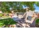 Backyard with artificial grass, a patio and privacy fencing at 329 Gemstone Hill Ave, North Las Vegas, NV 89031