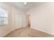 Bright carpeted bedroom with fan, window and sliding closet doors at 329 Gemstone Hill Ave, North Las Vegas, NV 89031