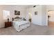 Bright bedroom with vaulted ceiling, neutral carpet, and coordinated bedding at 329 Gemstone Hill Ave, North Las Vegas, NV 89031