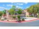 Beautiful single-story home with attached garage, concrete driveway, and verdant landscaping at 329 Gemstone Hill Ave, North Las Vegas, NV 89031