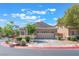 Attractive single-story home with a two-car garage and concrete driveway, under a sunny sky at 329 Gemstone Hill Ave, North Las Vegas, NV 89031