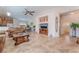 Open-concept living space features tile flooring and access to kitchen and dining areas at 329 Gemstone Hill Ave, North Las Vegas, NV 89031