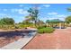 Beautiful community park featuring a covered picnic area, walking path, and lush landscaping for outdoor recreation at 329 Gemstone Hill Ave, North Las Vegas, NV 89031