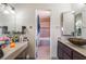 Bathroom with double vanity and a view to the tiled bathtub at 4356 Sabadell St, Las Vegas, NV 89121