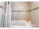 Bathroom features tub with tiled walls and stylish mosaic tile accents at 4356 Sabadell St, Las Vegas, NV 89121