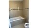 This bathroom features a tiled bathtub, a shower head, and stylish tile work at 4356 Sabadell St, Las Vegas, NV 89121