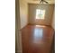 Bedroom features wood floors, a bright window, and a view to city life, offering a quiet ambiance at 4356 Sabadell St, Las Vegas, NV 89121