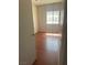 Cozy bedroom featuring wood floors and a window allowing natural light at 4356 Sabadell St, Las Vegas, NV 89121