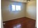 Bright bedroom with hardwood floors and a large window allowing ample natural light at 4356 Sabadell St, Las Vegas, NV 89121