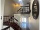 Bright foyer featuring stairs to the second level, tile floors, and a large decorative mirror at 4356 Sabadell St, Las Vegas, NV 89121