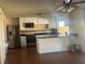 Bright kitchen featuring stainless steel appliances, tile backsplash, and peninsula with seating at 4356 Sabadell St, Las Vegas, NV 89121