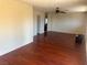 Open-concept living room featuring wood floors, neutral walls, and a ceiling fan at 4356 Sabadell St, Las Vegas, NV 89121