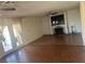 Spacious living room with a brick fireplace, ceiling fan, and sliding glass doors to outdoor area at 4356 Sabadell St, Las Vegas, NV 89121