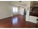 Spacious living room featuring wood floors, neutral walls, and windows with decorative curtains at 4356 Sabadell St, Las Vegas, NV 89121